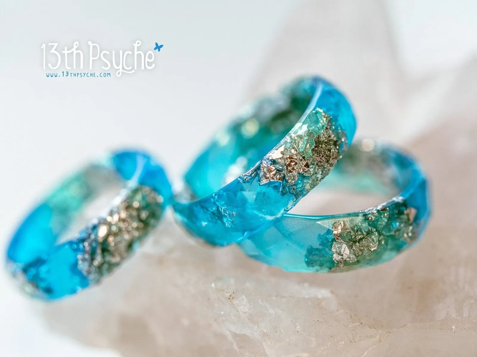 Clear blue and turquoise faceted resin ring with silver flakes