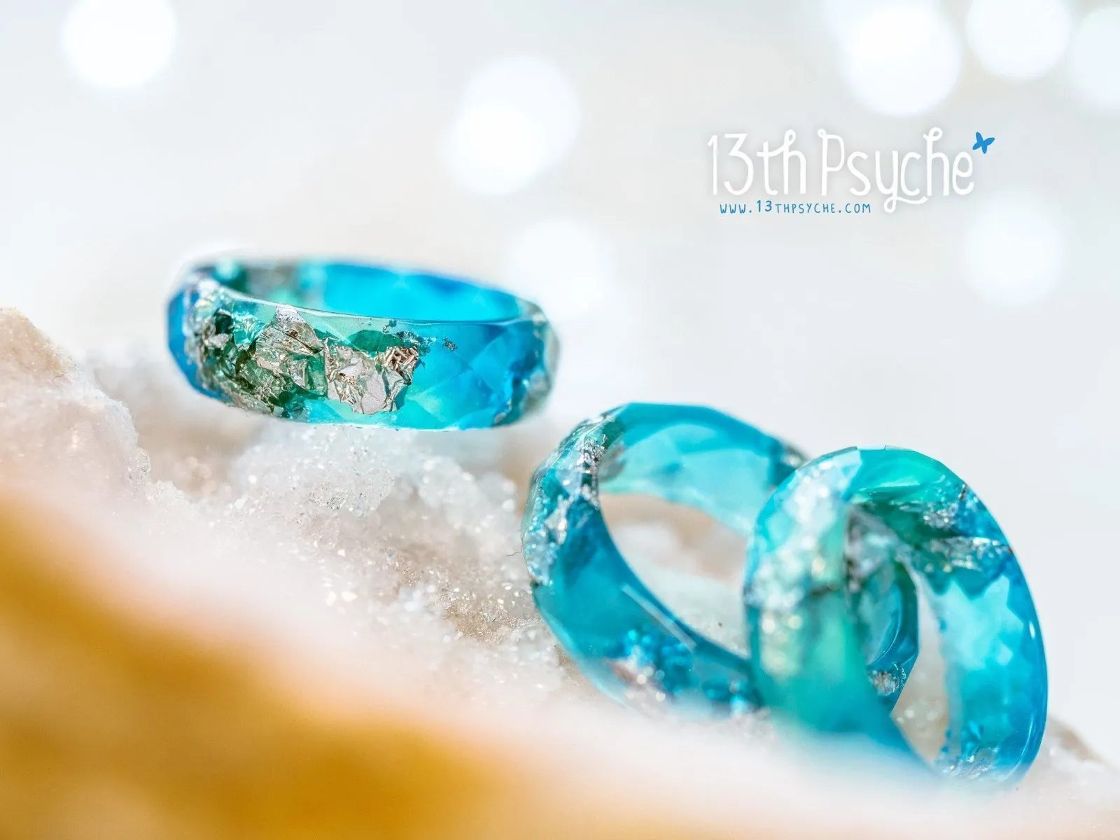 Clear blue and turquoise faceted resin ring with silver flakes