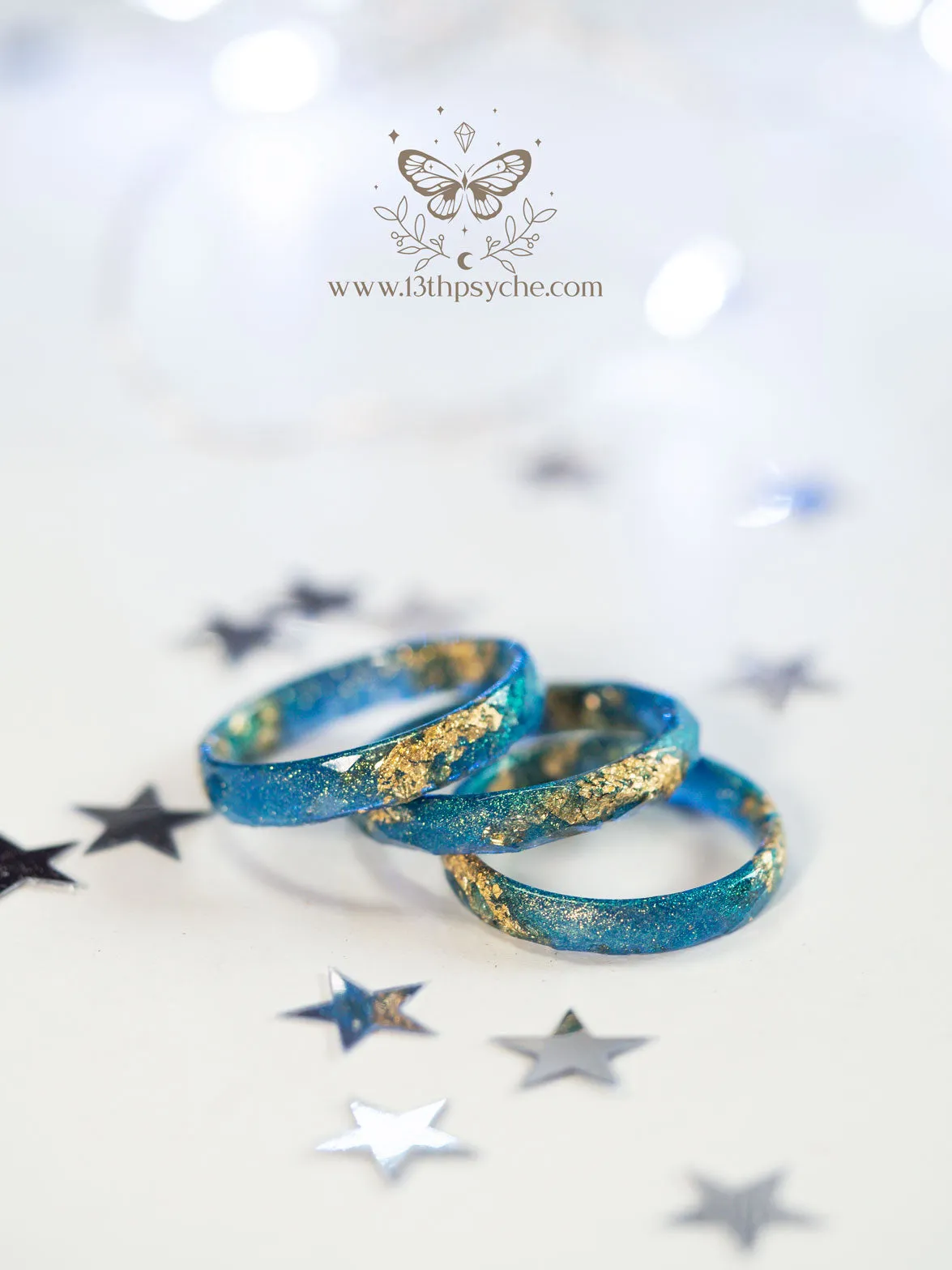 Iridescent blue faceted resin ring with gold metal flakes