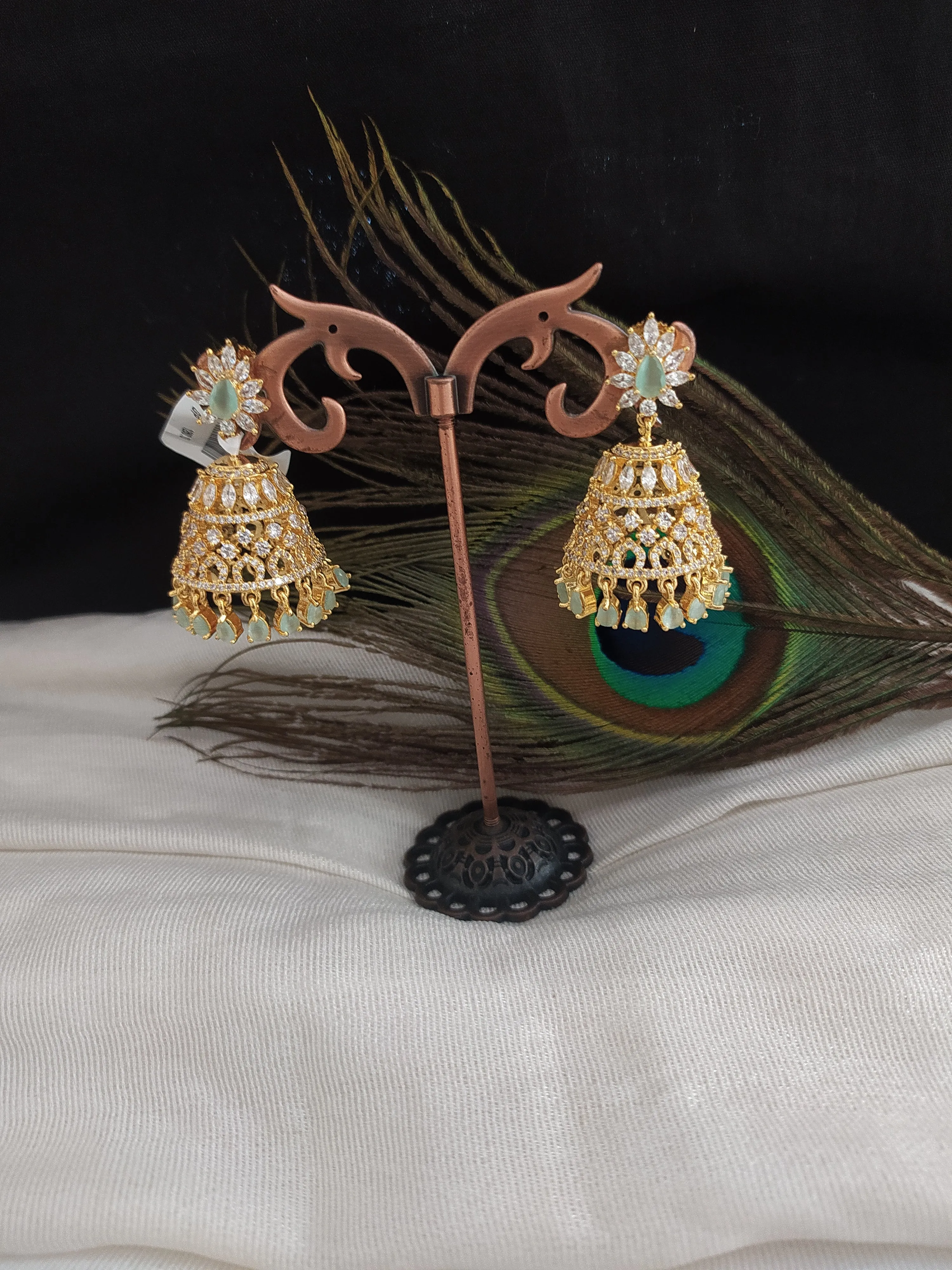 Sparkling Gold Plated Jhumka With Zircon Stones